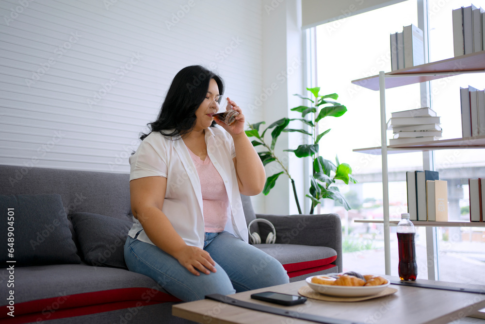 Plus size woman is eating donut. Plus size woman is eating donut.