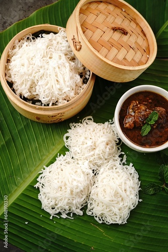 Idiyappam with Chicken curry | Kerala steamed breakfast made of rice flour photo
