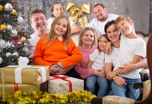 Family with children on sofa in christmas interior