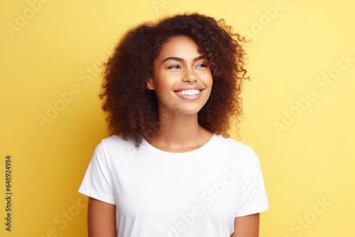 Happiness African Woman In White Tshirt On Pastel Background . Сoncept Happiness, African American Women, White Tshirt Style, Pastel Backgrounds © Anastasiia