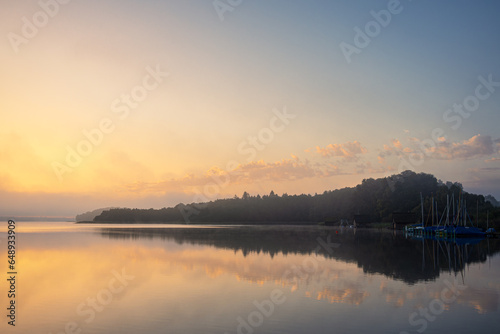 Sonnenaufgang in Seedorf am Schaalsee mit Wolken und Spiegelung photo