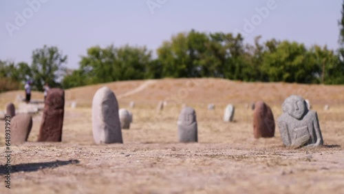 Ancient gravestones called balbals near Bunara Tower in Kyrgyzstan photo