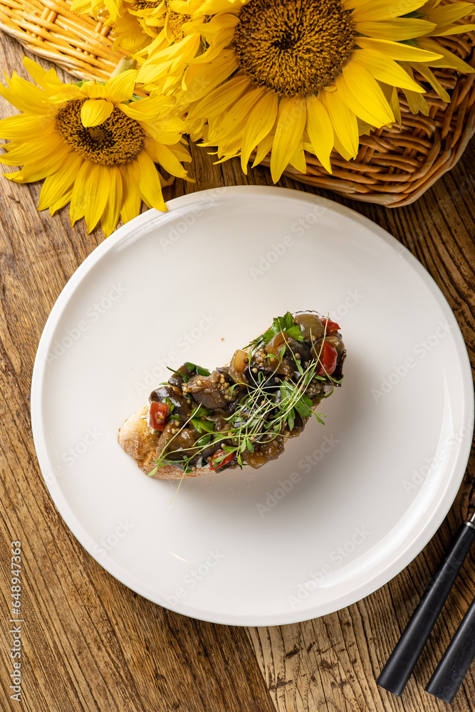 Delicious bruschetta with vegetables and meat Delicious bruschetta with vegetables and meat