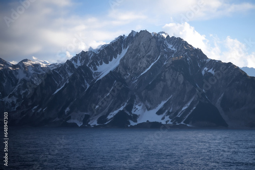 Wallpaper Mural The image shows the breathtaking landscape of Patagonia in Argentina, where the Andes Mountains meet the Atlantic Ocean. The rugged peaks of the Andes contrast with the calm waters of the ocean. Torontodigital.ca