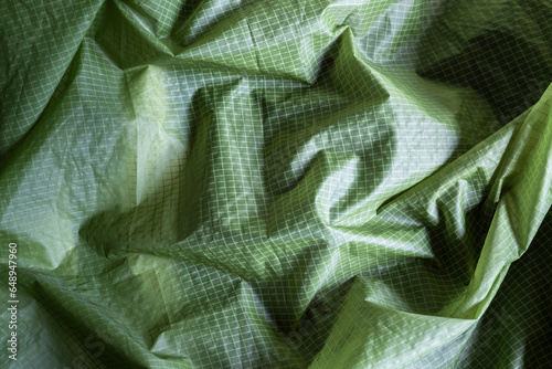 closeup of green nylon checkered tent fabricm, textere background
 photo