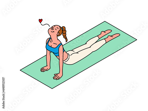 Young woman stretching on a yoga mat.