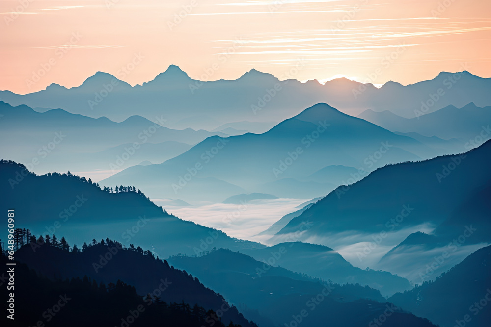 Fototapeta premium Mountain range with visible silhouettes through the morning colorful fog.