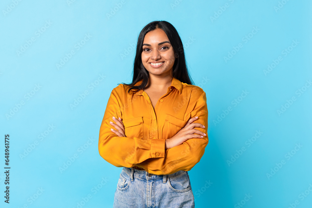 Arab Young Lady Crossing Hands Expressing Positive Emotions, Blue Background Arab Young Lady Crossing Hands Expressing Positive Emotions, Blue Background
