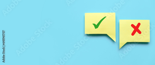 Concept of evaluation. True or false symbol. Accepted or rejected. Yes or no icon over a yellow bubble chat on blue background with copy space.