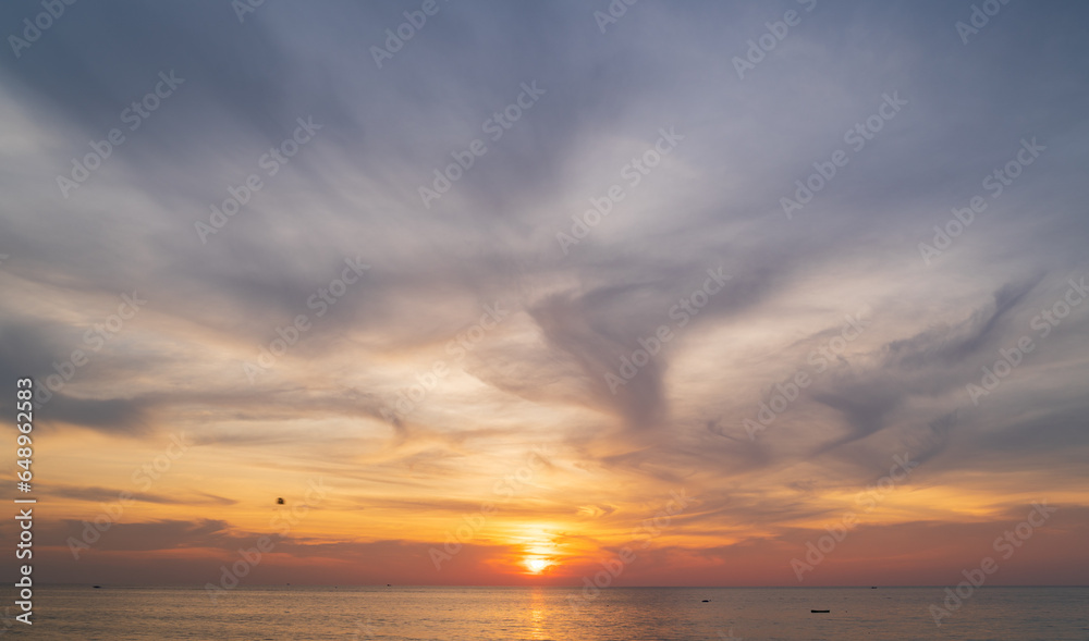 Naklejka premium Abstract amazing Scene of stuning Colorful sunset or sunrise with clouds background in nature and travel concept, wide angle shot Panorama shot,Copy space