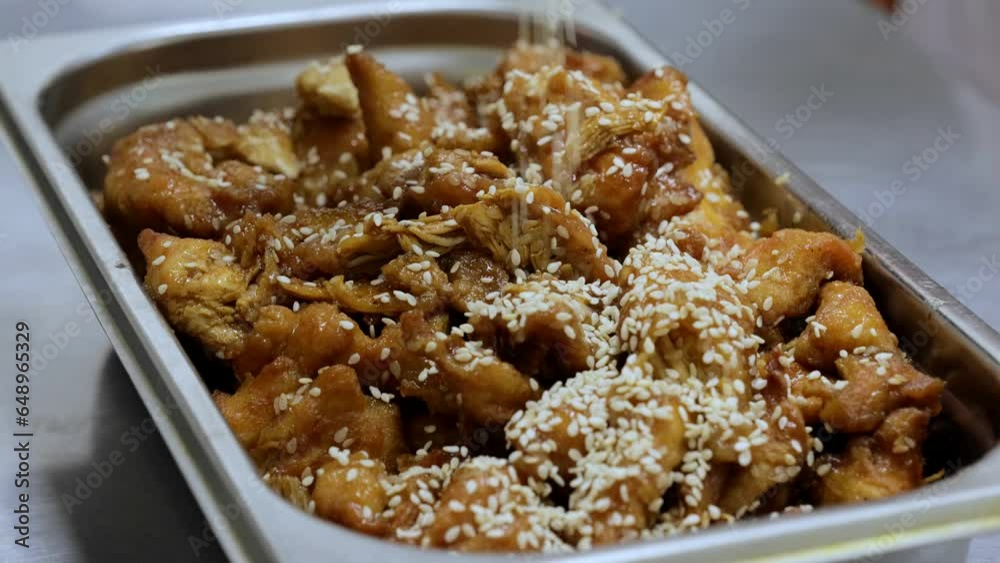 Fried chicken in sauce, Korean traditional food, Korean fried chicken with spicy sauce, honey mustard chicken. Fried chicken in sauce, Korean traditional food, Korean fried chicken with spicy sauce, honey mustard chicken.