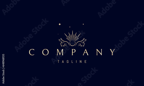 A vector golden logo with an abstract image of angel wings with a sun in the middle.