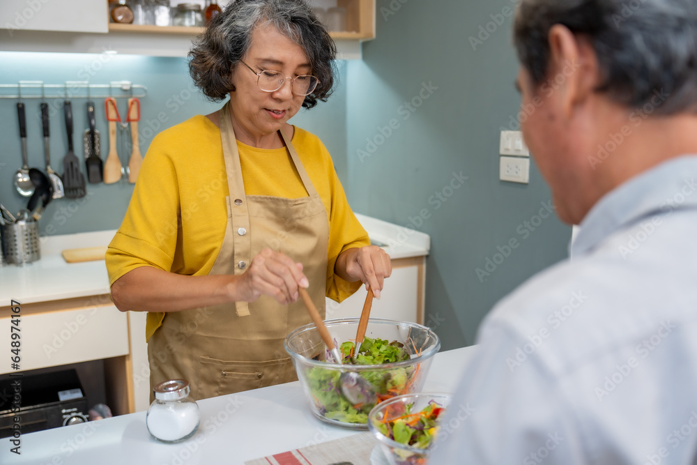 Elderly couple cooking healthy food with fun in the kitchen. Elderly couple cooking healthy food with fun in the kitchen.