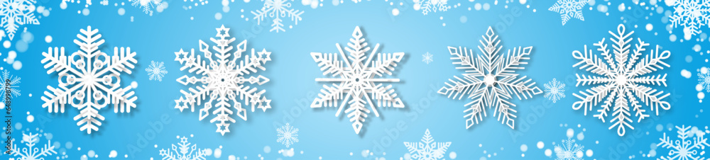 A set of white snowflakes with a paper effect and a shadow on a blue background. The element of Christmas and New Year. The symbol of winter. Vector illustration. A set of white snowflakes with a paper effect and a shadow on a blue background. The element of Christmas and New Year. The symbol of winter. Vector illustration.
