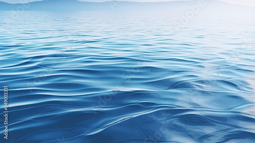 Fototapeta Naklejka Na Ścianę i Meble -  Background with smooth water ripples smoothly spreading across the surface.
