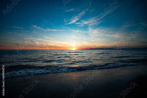 Fototapeta Naklejka Na Ścianę i Meble -  Italian sunset on the beach in landscape, Capri and Ischia in background