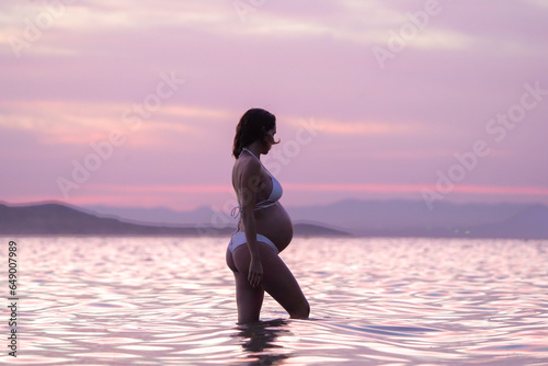 Pregnant at beach photo