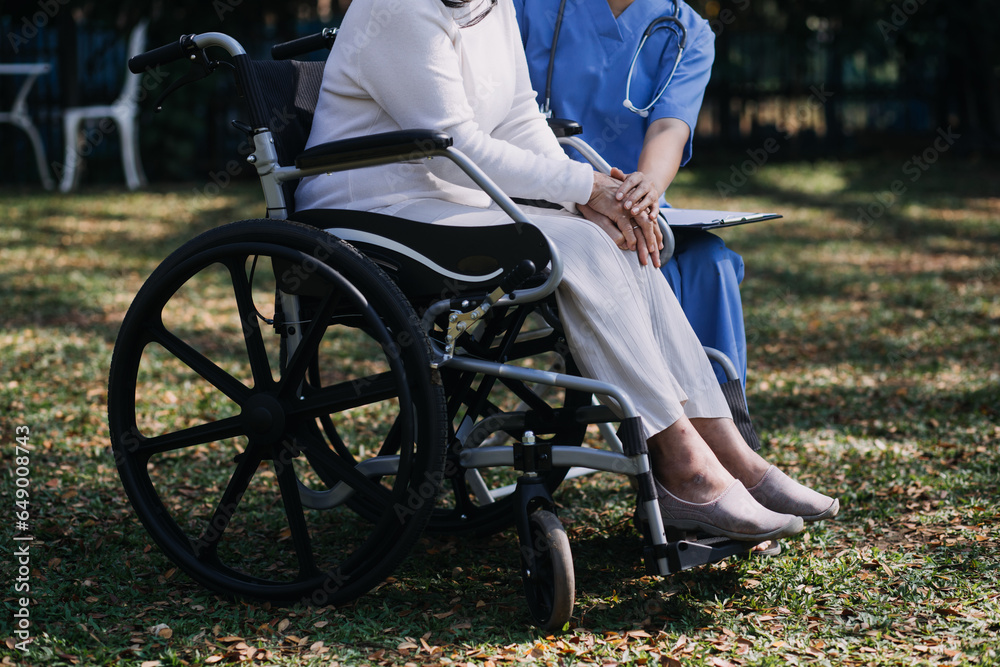 Fototapeta premium Asian young woman nurse at nursing home take care disabled senior man. Caregiver doctor serve physical therapy for older elderly patient to exercise and practice walking on walker or cane at backyard.