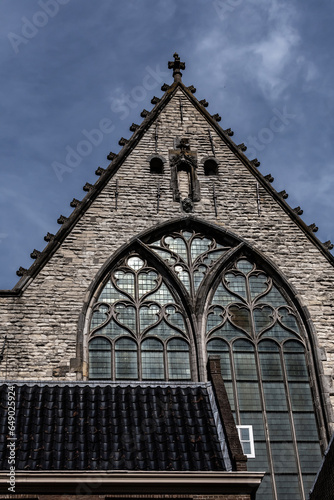 Amsterdam Old Church (Oude Kerk), oldest parish church, founded in 1213. Oude Kerk stands in Amsterdam De Wallen district on Old Church's Square (Oudekerksplein). Amsterdam, The Netherlands. photo