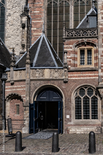 Amsterdam Old Church (Oude Kerk), oldest parish church, founded in 1213. Oude Kerk stands in Amsterdam De Wallen district on Old Church's Square (Oudekerksplein). Amsterdam, The Netherlands. photo