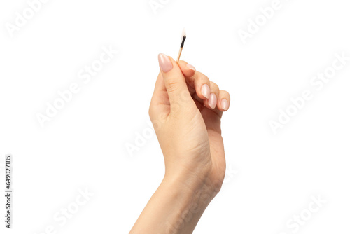 Lit match in a woman hand isolated on a white background. © Nikolay