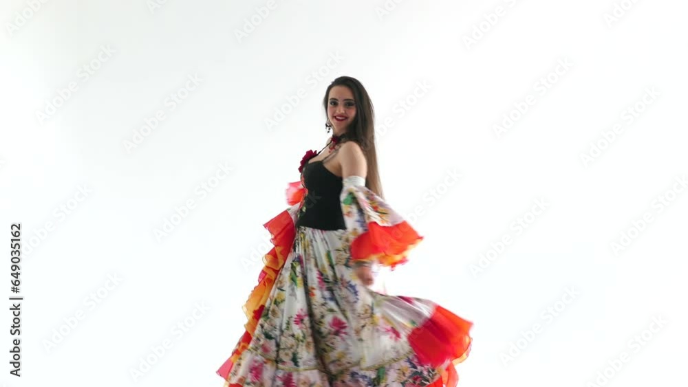 A young girl demonstrates an elegant dress 4K. Model's gait. Beautiful girl posing in an elegant long dress on a white background. A young girl demonstrates an elegant dress 4K. Model's gait. Beautiful girl posing in an elegant long dress on a white background.