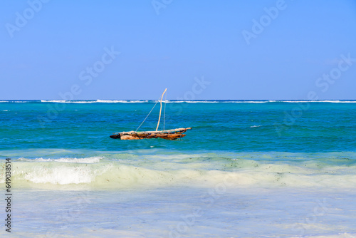 Traditional wooden fishing boat dhow at Zanzibar island, Tanzania