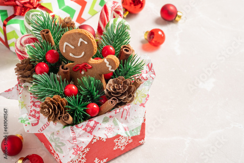Christmas Decorations with Gingerbread man cookie and Gift Box.