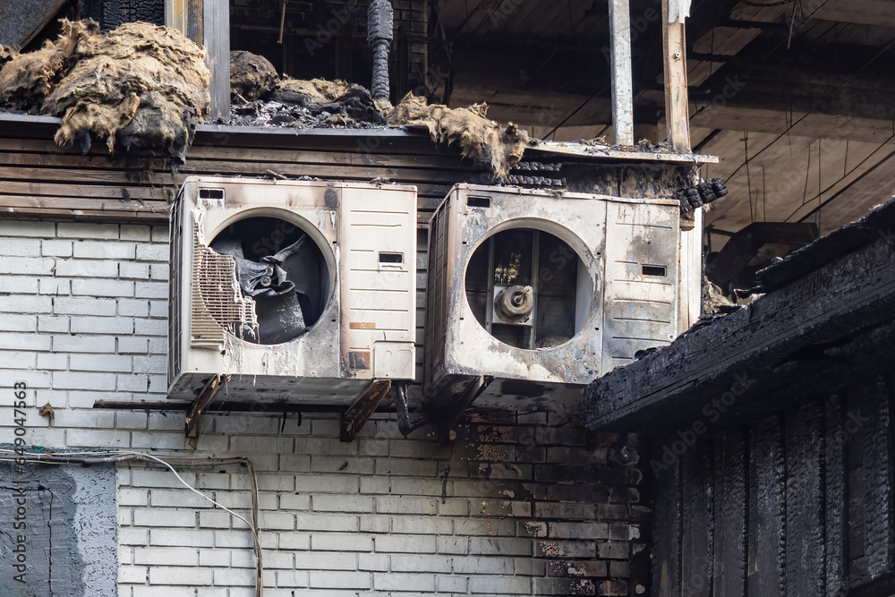 Facade burnt building. House was damaged by fire. Burnt out air