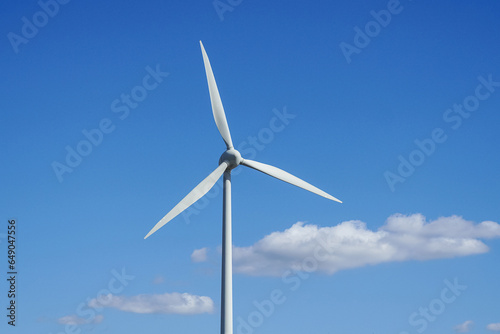 Wind turbine blades on blue sky background © Marcin Rogozinski