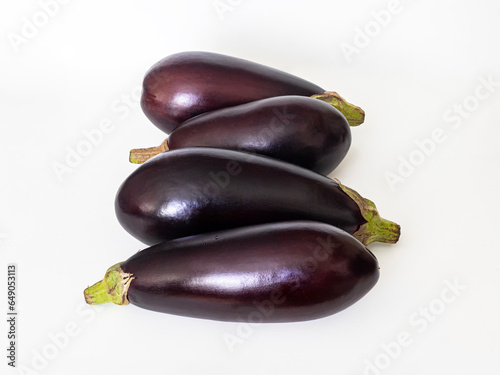 Purple eggplants on a white background