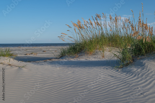 Sand dunes on the beach photo