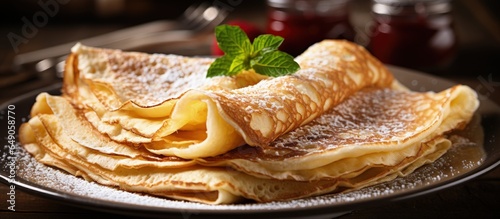 Close up of two French style crepes with ingredients in the background with copyspace for text