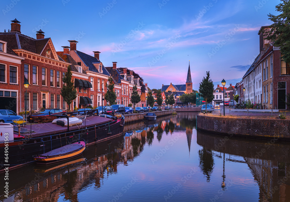 Harlingen canal at sunset. Cityscape of a Dutch city.