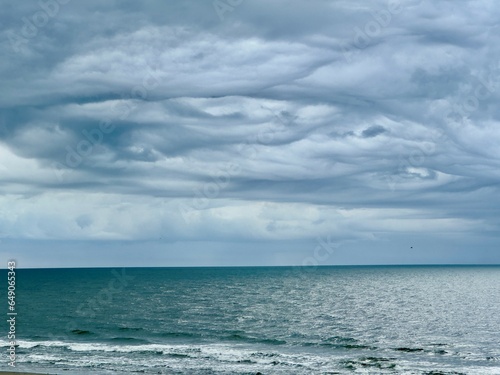 Fototapeta Naklejka Na Ścianę i Meble -  Unusual clouds over ocean. 