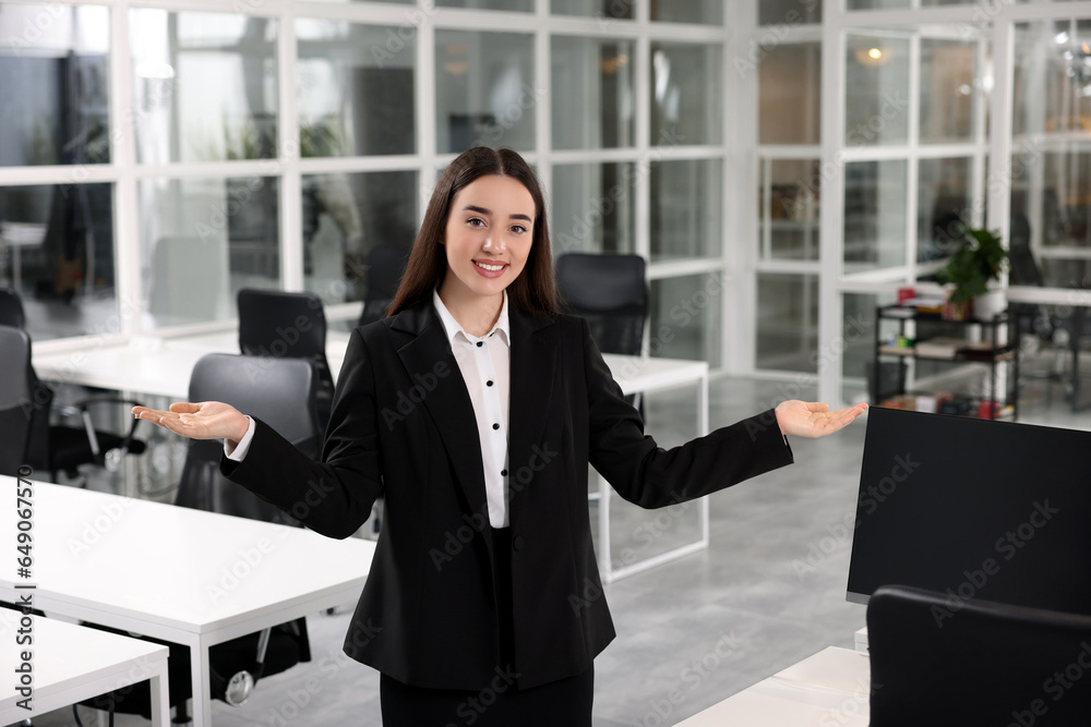 Happy female real estate agent in office Happy female real estate agent in office