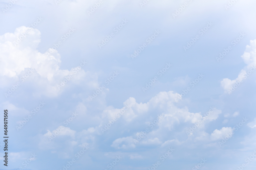 Blue sky background and white clouds soft focus, and copy space horizontal shape.