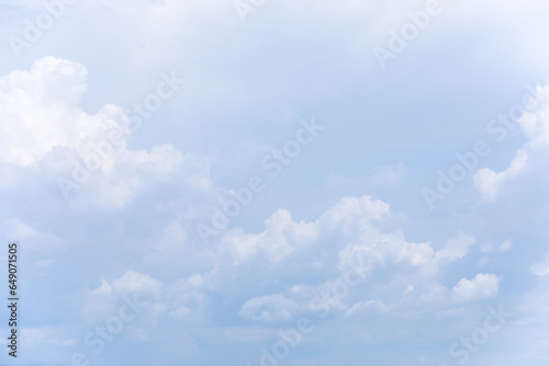 Obraz na płótnie Blue sky background and white clouds soft focus, and copy space horizontal shape. w salonie