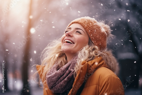 Happy blond girl smile enjoys snowy winter, christmas holiday