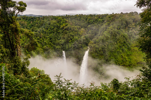 Landscape of Tad Fan waterfall covering with fog in the morning in Champasak  Laos