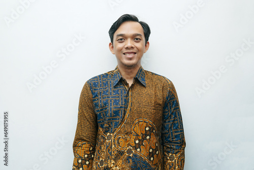 Portrait of Asian Indonesian man wearing batik shirt traditional cloth