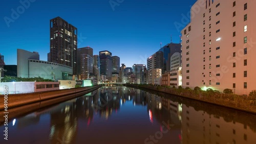 Osaka, Japan Cityscape on the Ogawa River from dawn till day. photo