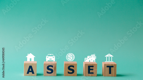 Wooden cubes with assets icon on background, Asset management and financial accounting, House and property investment and asset management, Interest rates, Loan mortgage photo