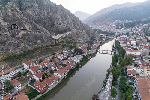 Amasya,TURKEY old riverside Turkish(ottoman) city buildings and its reflection on water,sunny summer day.Amasya is city of princes of ottoman. ottoman Princes were educated in Amasya