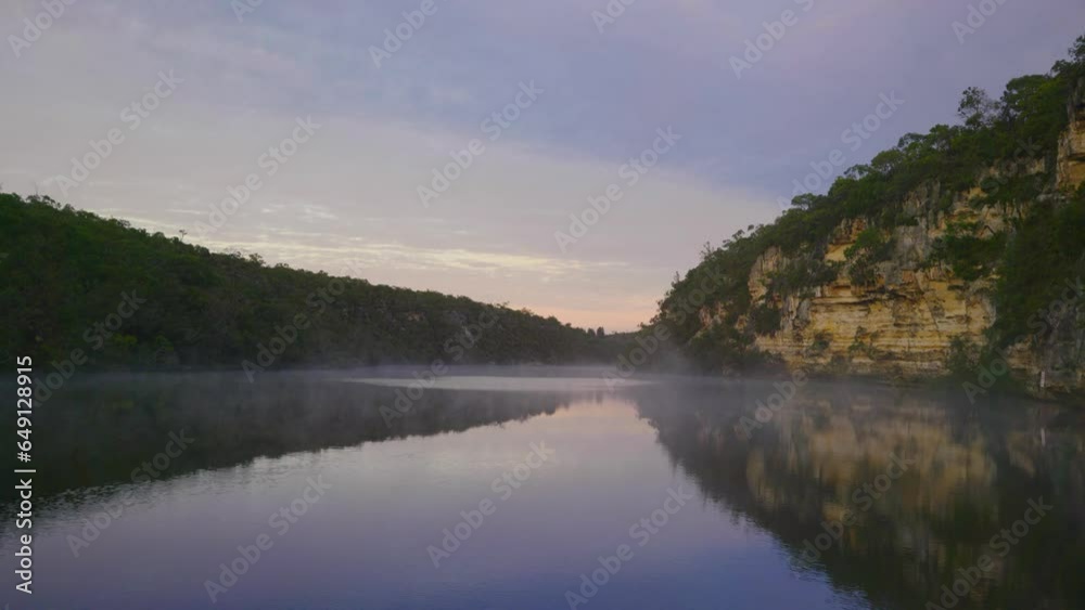 Mist rising from a calm lake in the morning Mist rising from a calm lake in the morning