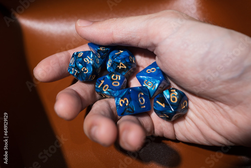 Hand holding various kind of dices photo