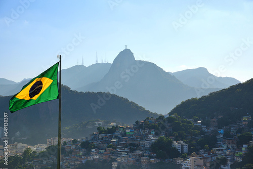 The Brazilian Flag, the Corcovado Mountain and the Favela in Morro da Babilônia, seen from Forte Duque de Caxias (Forte do Leme) - Rio de Janeiro, Bra photo