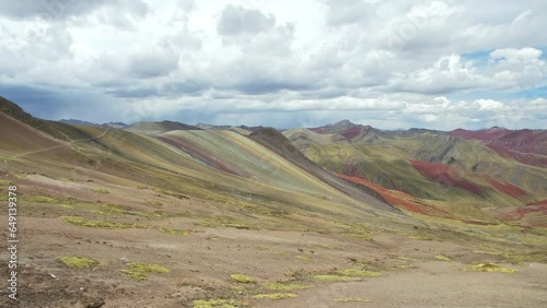 Camera Pan Rainbow Mountains, Vinicunca, Winikunka, Red Valley in Slow Motion photo