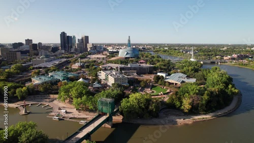 Downtown Winnipeg, MB aerial. Red and Assiniboine Rivers, Forks and city skyline, 4K photo
