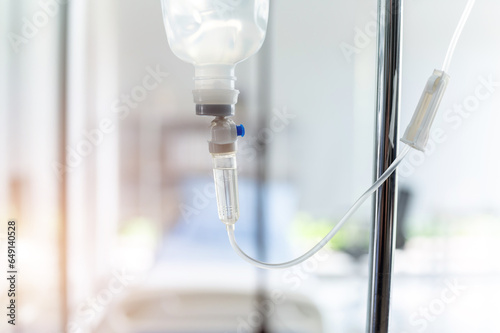 Saline solution vitamin iv fluid intravenous drip droper with medicine for patient and infusion pump in hospital hospitel concept treatment emergency and injection drug infusion care chemotherapy photo